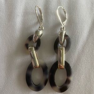 Gray tortoise and silver tone fashion earrings.